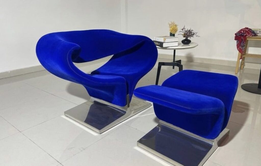 Ribbon Chair and matching ottoman in a vibrant blue velour